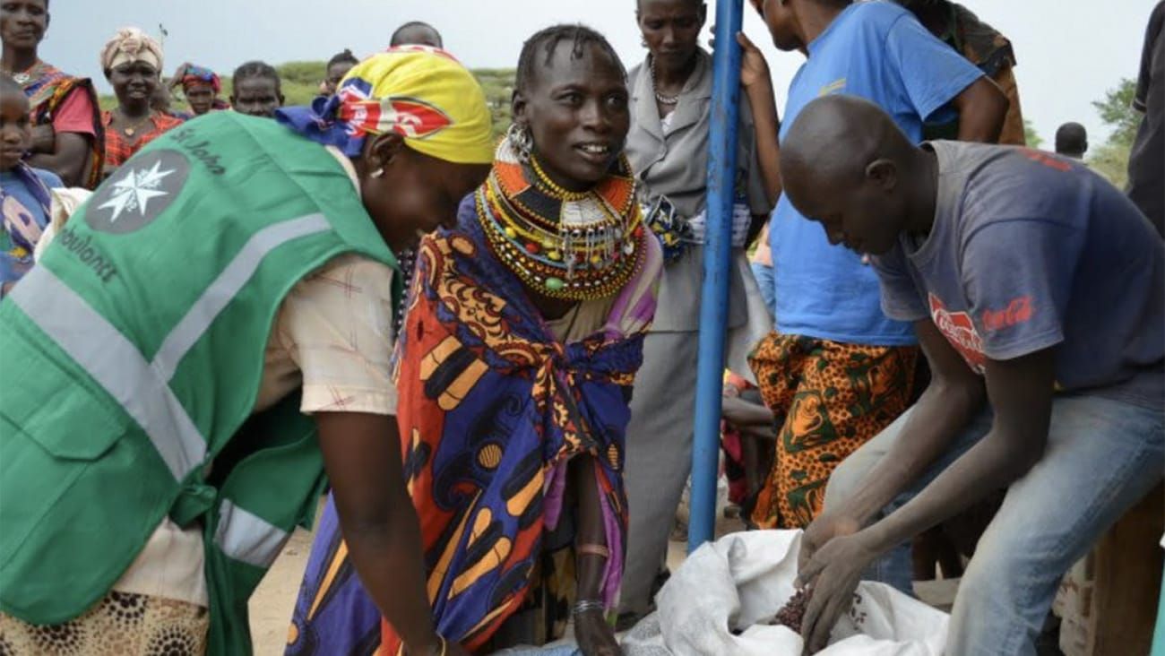 Ghananian people with an aid worker